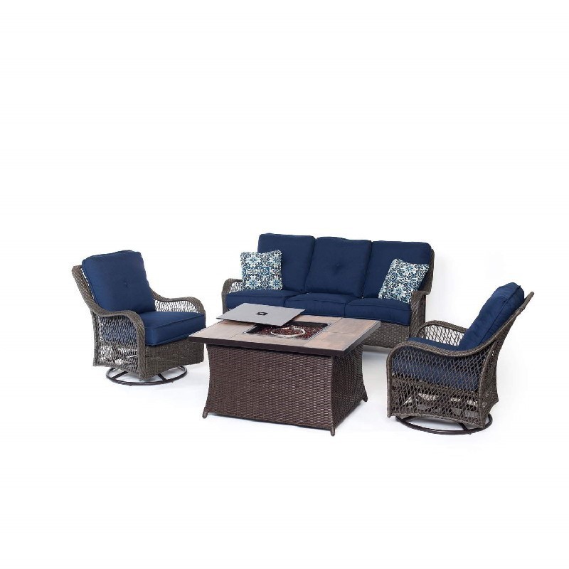 HANOVER ORLEANS4PCFP-NVY-A ORLEANS 4-PIECE WOVEN LOUNGE SET WITH GLAZED FAUX-WOOD TILES FIRE PIT TABLE IN NAVY BLUE, BLUE KALEIDOSCOPE PILLOW PATTERN