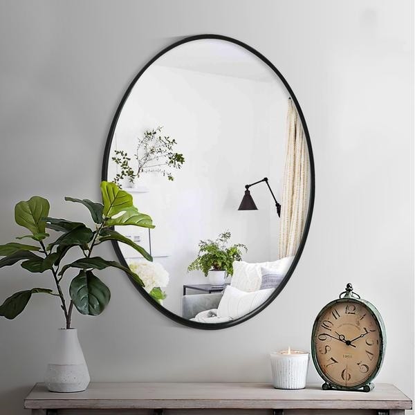 THE URBAN PORT UPT-228707 21 INCH OVAL METAL WALL MIRROR WITH FRAMED EDGES AND WOODEN BACKING - BLACK