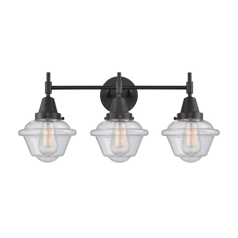 INNOVATIONS LIGHTING 447-3W-G534 CADEN 3 LIGHT 25 1/2 INCH SEEDY GLASS VANITY LIGHT