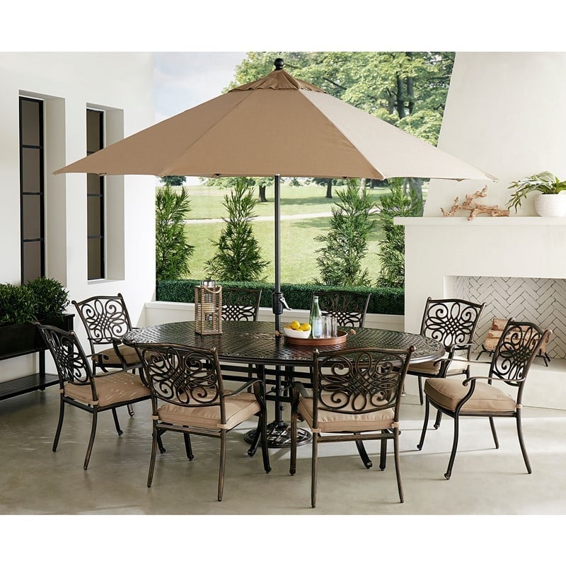 HANOVER TRADDN9PCOV-SU-T TRADITIONS 9-PIECE DINING SET WITH 8 DINING CHAIRS, OVAL CAST TOP TABLE, UMBRELLA AND STAND - TAN AND BRONZE