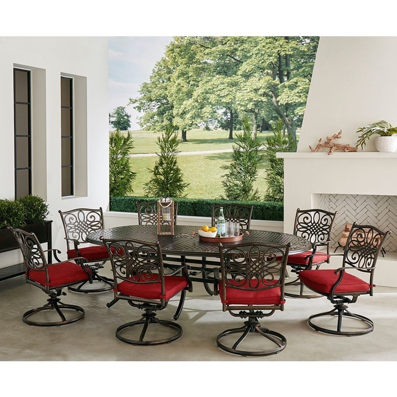 HANOVER TRADDN9PCOVSW8-RED TRADITIONS 9-PIECE DINING SET WITH 8 SWIVEL ROCKERS AND OVAL CAST TOP DINING TABLE - RED AND BRONZE