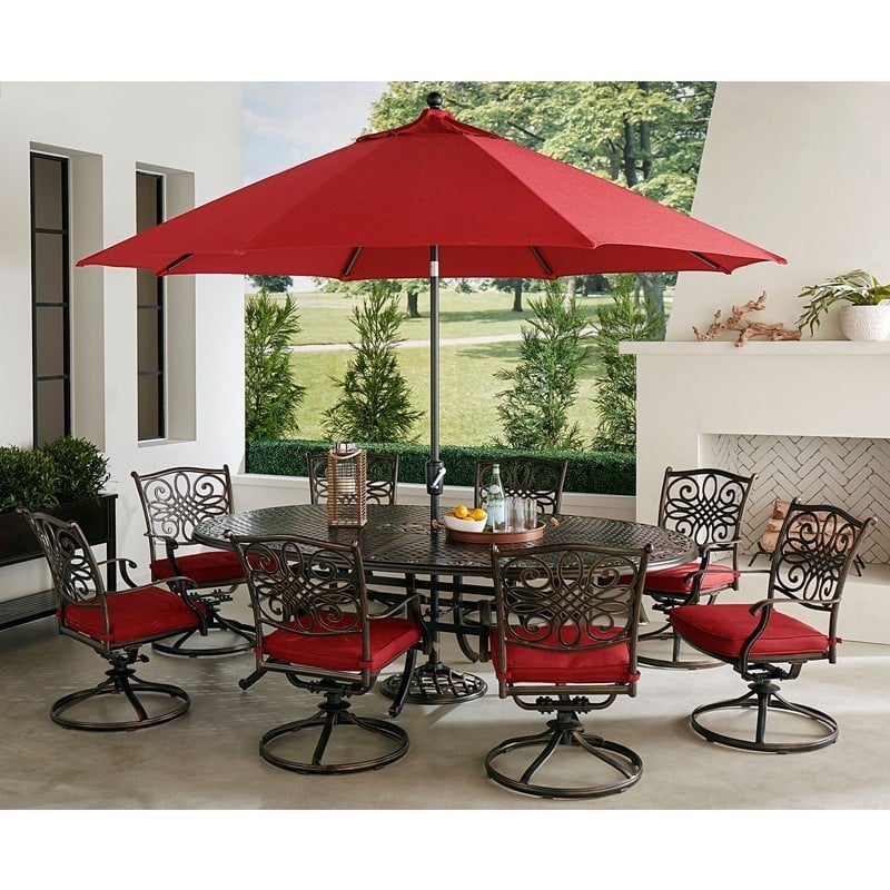 HANOVER TRADDN9PCOVSW8-SU-R TRADITIONS 9-PIECE DINING SET WITH 8 SWIVEL ROCKERS, OVAL CAST TOP TABLE, UMBRELLA AND UMBRELLA STAND - RED AND BRONZE