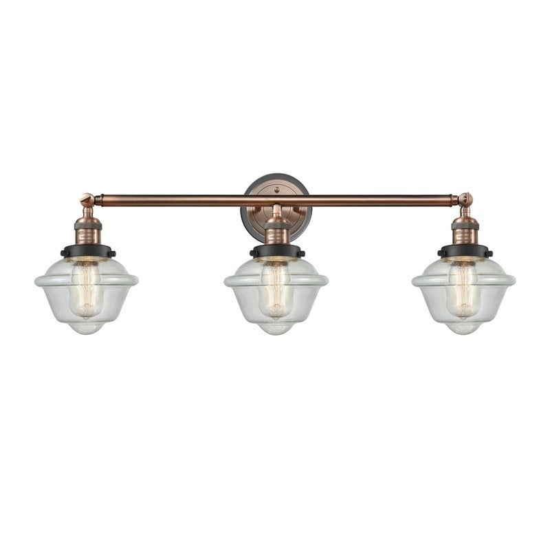 INNOVATIONS LIGHTING 205BP-ACBK-G534 FRANKLIN RESTORATION SMALL OXFORD 3 LIGHT 34 INCH SEEDY GLASS VANITY LIGHT - ANTIQUE COPPER/MATTE BLACK